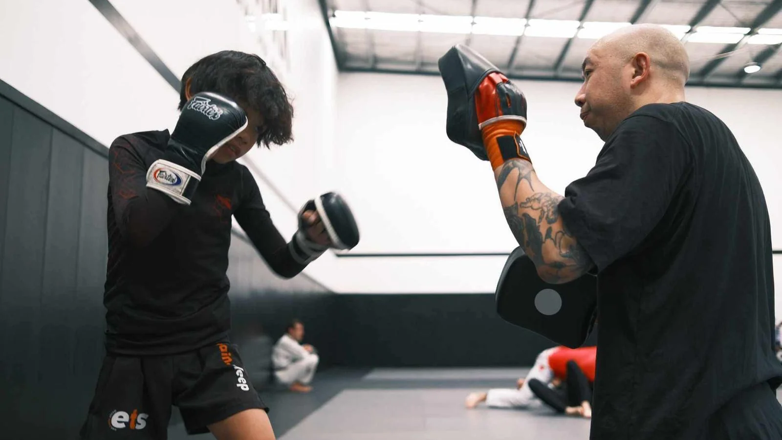 Muay Thai training session with pad work at a Melbourne martial arts gym